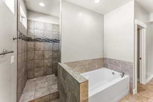 Full bathroom featuring a garden tub, a walk in shower, and recessed lighting