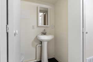 Bathroom with toilet and baseboards