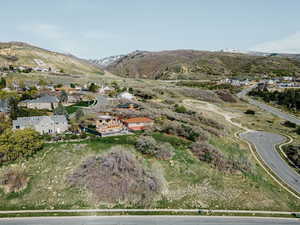 Aerial view of property's location featuring mountains and neighborhood