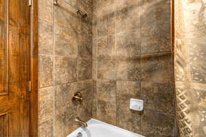 Bathroom with shower / bathtub combination