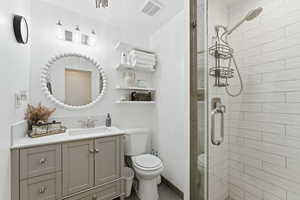 Full bath featuring vanity and a stall shower