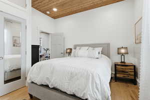 Bedroom featuring wooden ceiling, light wood-style floors, and recessed lighting