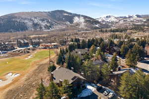 View of property location featuring nearby suburban area and a mountainous background