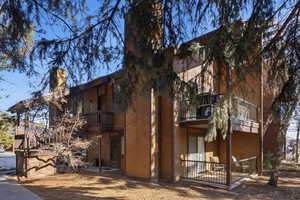 View of home's exterior with a patio and a balcony