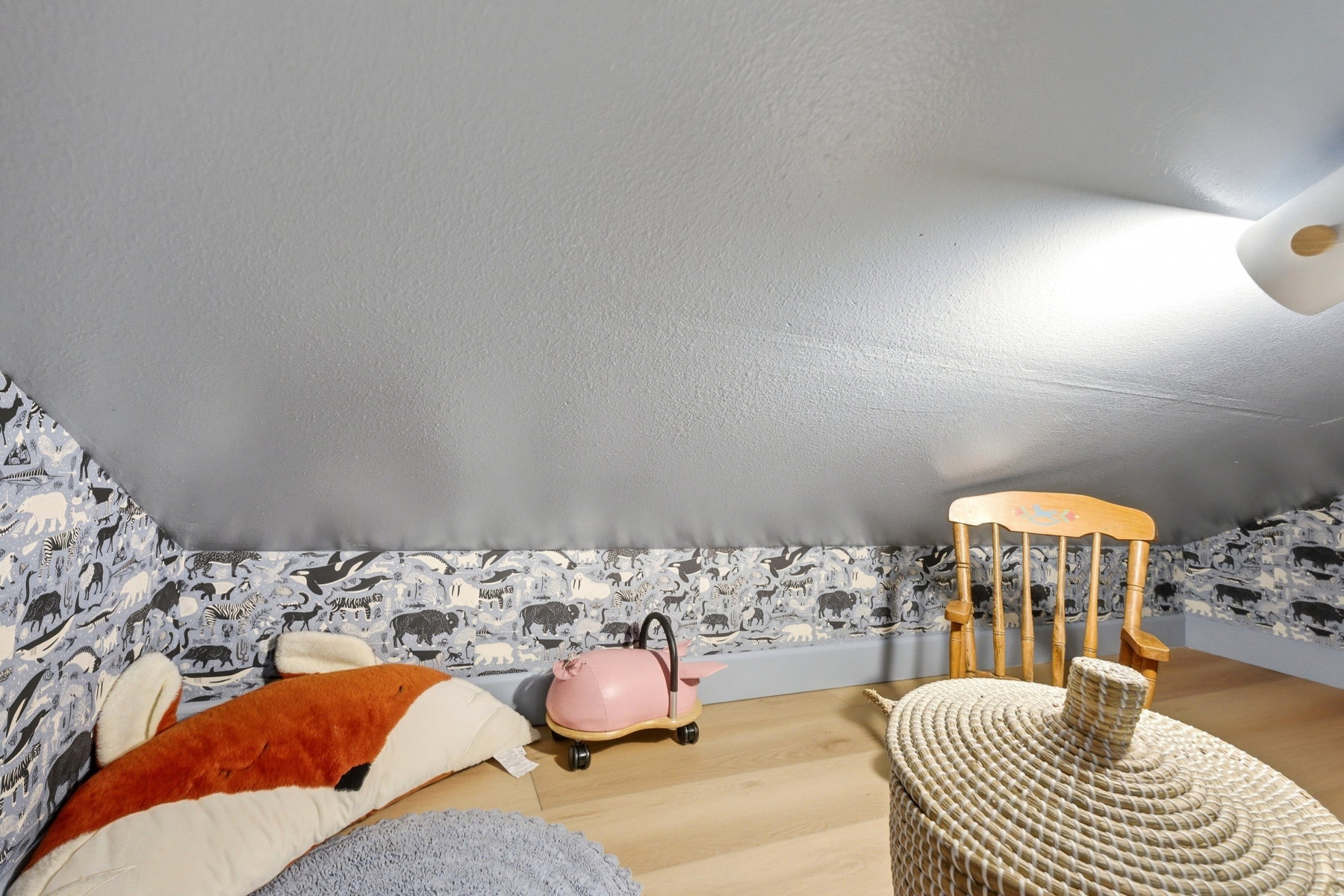 Bedroom with wood finished floors and a textured ceiling