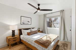 Bedroom with light wood-style floors and ceiling fan