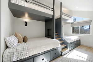 Bedroom featuring light wood-style flooring and baseboards