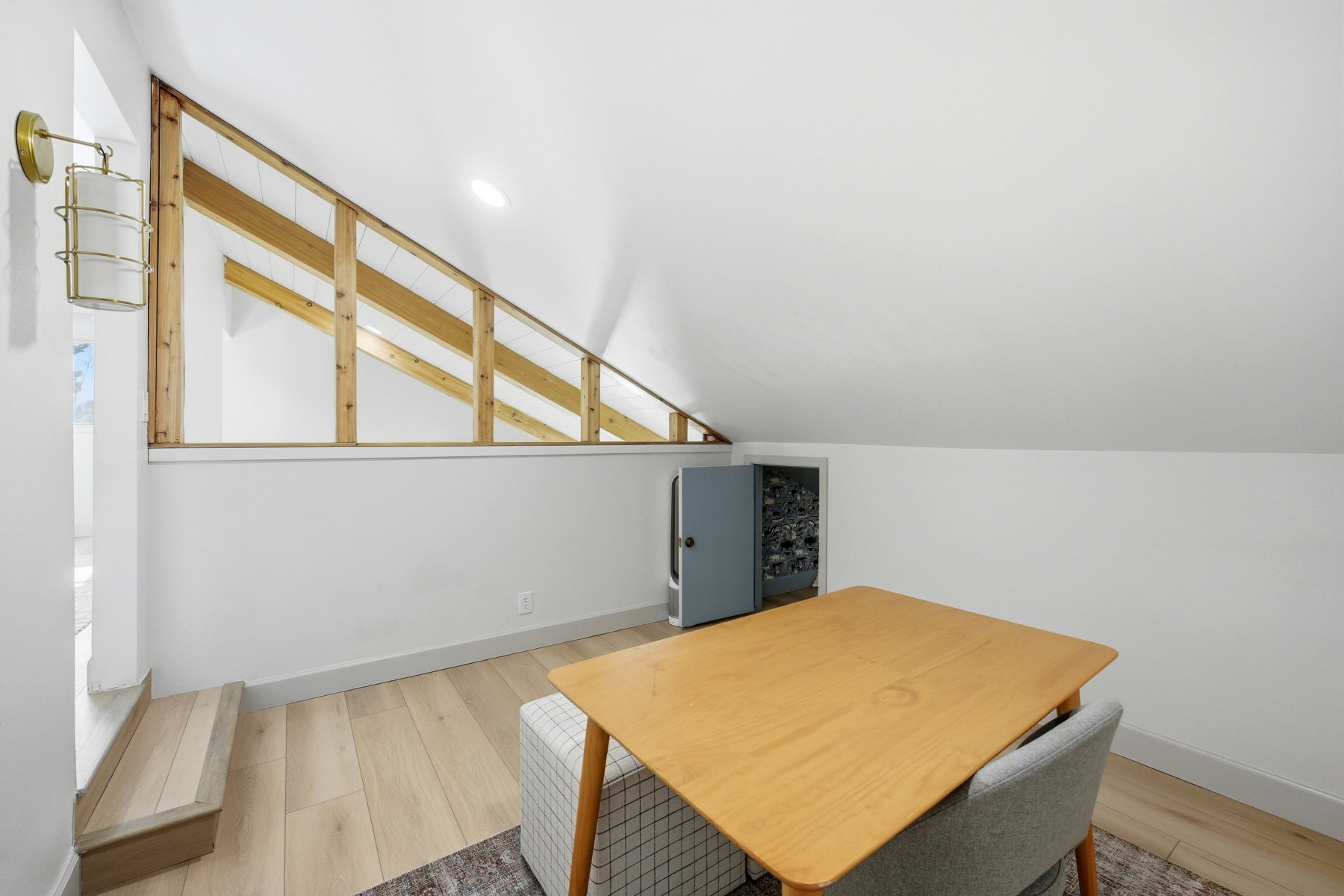 Office featuring light wood-style flooring and lofted ceiling
