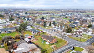 Aerial overview of property's location featuring nearby suburban area