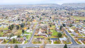 Aerial view of property's location with nearby suburban area