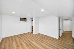 Unfurnished room featuring light wood-style floors and recessed lighting