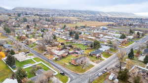 Aerial view of property's location with nearby suburban area