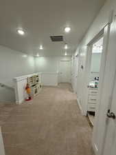 Recreation room with light colored carpet, recessed lighting, and a textured ceiling