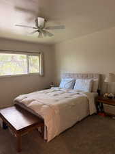 Bedroom with carpet floors and a ceiling fan