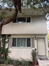 View of side of property with brick siding