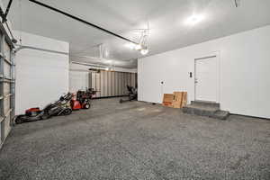 Garage featuring a garage door opener