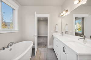 Full bath featuring a soaking tub and double vanity