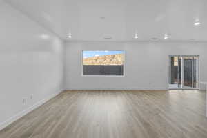 Unfurnished room featuring light wood-style flooring and recessed lighting