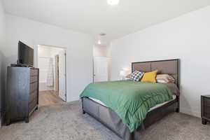 Primary Bedroom featuring connected bathroom