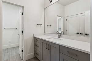 Bathroom with vanity and baseboards