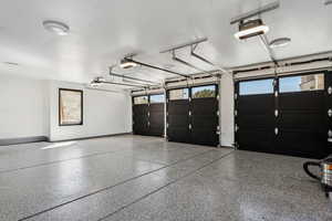 Garage featuring a garage door opener