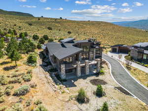 View from above of property with a mountain backdrop