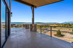 View of patio with a mountain view