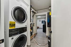 Laundry area featuring stacked washer / dryer