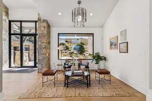 Sitting room with light wood-type flooring, recessed lighting, and vaulted ceiling