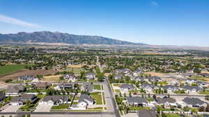 Aerial view of residential area featuring mountains