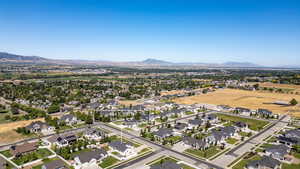 Aerial perspective of suburban area featuring a mountain backdrop