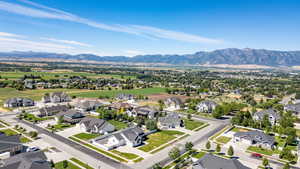 Aerial perspective of suburban area featuring a mountainous background