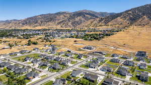 Aerial perspective of suburban area featuring a mountain backdrop