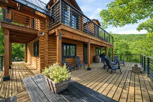 Wooden deck featuring a wooded view