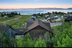Aerial view at dusk of a water and mountain view and a residential view