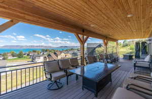 Deck with an outdoor lounge area, a mountain view, and a residential view