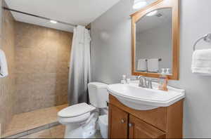 Bathroom with vanity and a stall shower