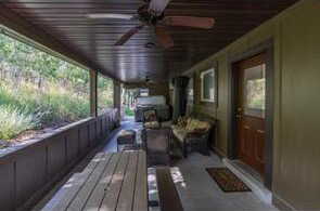 Deck with an outdoor hangout area and a ceiling fan