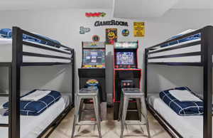 Bedroom featuring light carpet