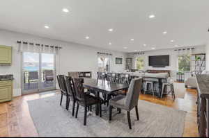 Dining room featuring light wood-style floors and recessed lighting