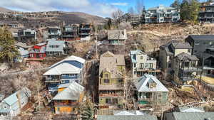 Aerial perspective of suburban area featuring a mountainous background