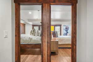 Bedroom with light wood-type flooring and recessed lighting