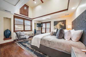 Bedroom with wood-type flooring and a ceiling fan