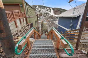 View of patio featuring a mountain view and stairway
