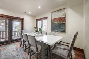 Dining space featuring wood finished floors and recessed lighting