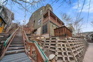 View of home's exterior with stairway