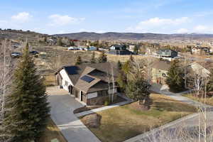 Aerial perspective of suburban area featuring a mountainous background