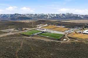 Aerial overview of property's location with a mountainous background