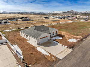Aerial perspective of suburban area featuring a mountain backdrop