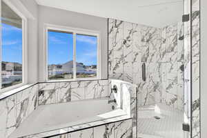 Primary  Bathroom with jetted tub and seperate large shower with stunning tile.